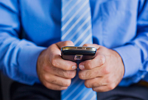 getty_rf_photo_of_man_texting_on_phone